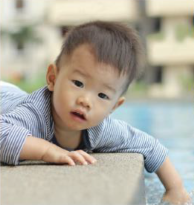 A baby by the pool