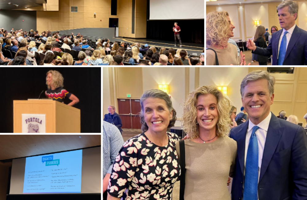 A speaker addresses a large audience in an auditorium.