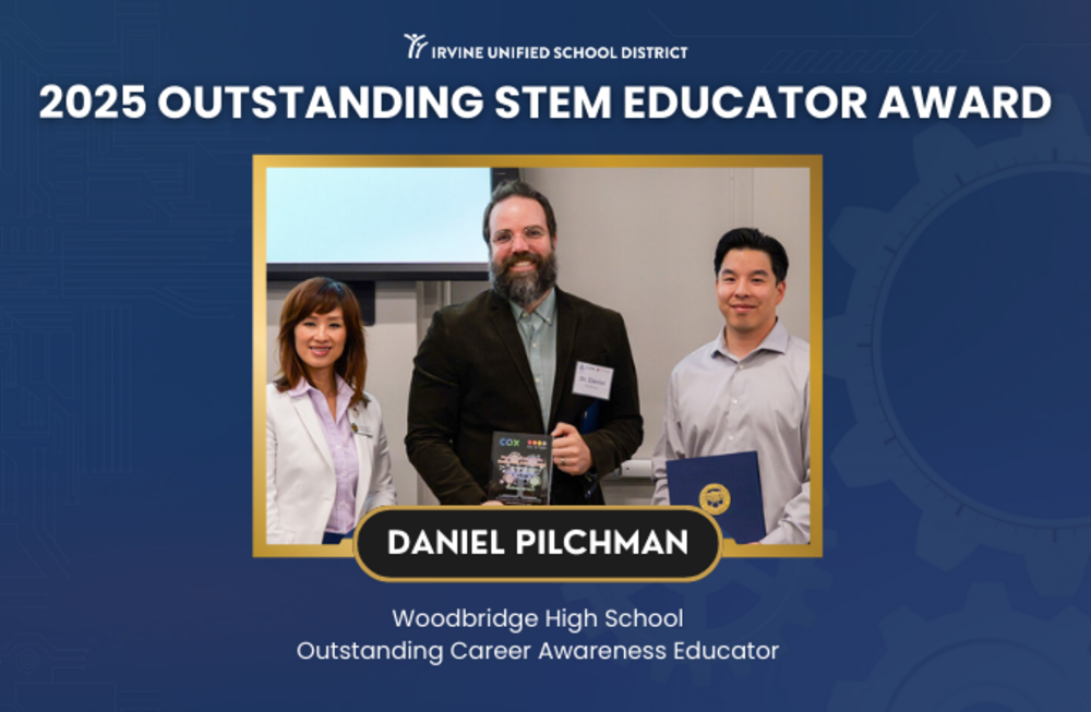 Three educators stand together, celebrating an award for STEM education.