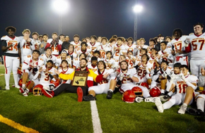 Woodbridge High Football Team posing with CIF Southern Section Championship plaque