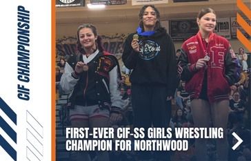 Three young women stand on a podium, each holding a medal, celebrating a wrestling championship.