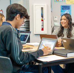 High school students on Chromebooks in classroom