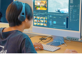 Student editing video on computer