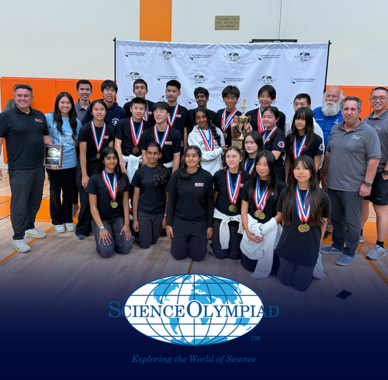 Sierra Vista team and coaches pose for a photo, holding a trophy and a plaque, all wearing medals.