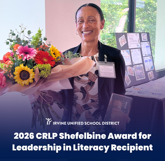 Dr. Natalie Baptiste smiles, holding a large bouquet of colorful flowers and a book, recognized as the 2026 CRLP Shefelbine Award for Leadership in Literacy Recipient.