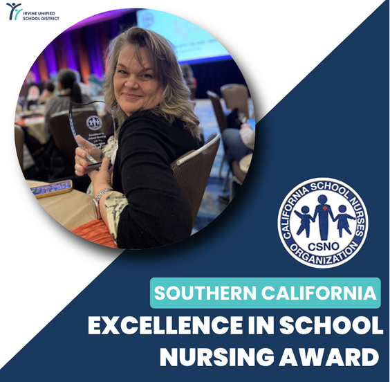 Krista Elliott smiles while holding a glass award at an event, with the Irvine Unified School District logo visible.
