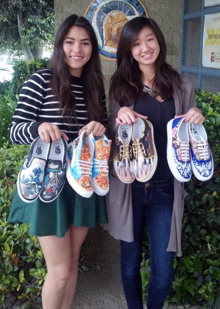 Uni junior Aki Barbar, left, and senior Katherine Wang display their customized kicks for the Vans Custom Culture art contest.