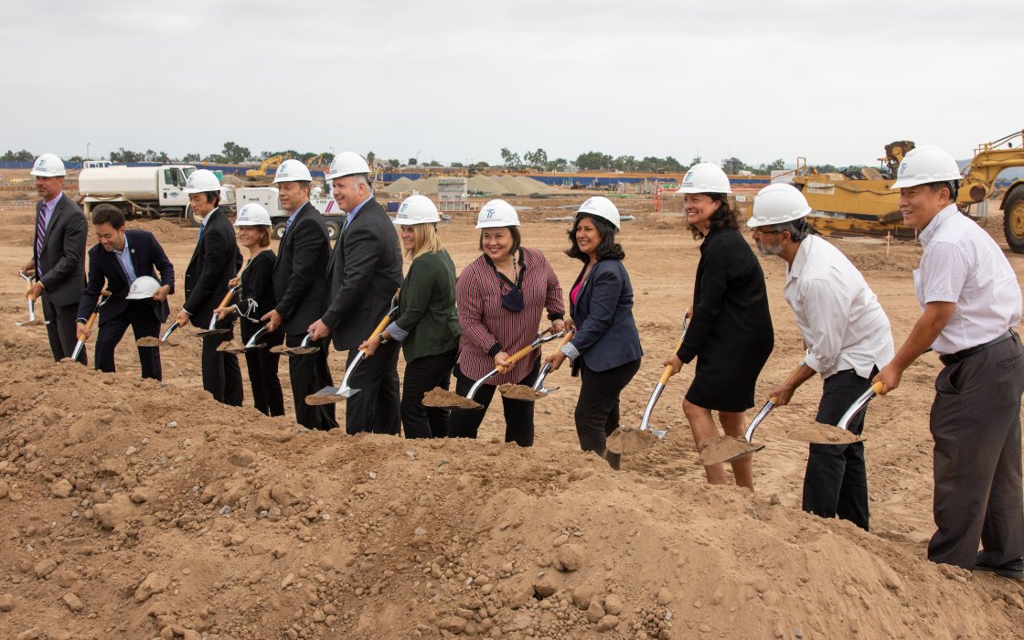 Superintendent Terry Walker, IUSD Board and Irvine City Officials posing with shovels