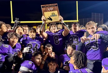 Portola football team posing with CIF winning plaque