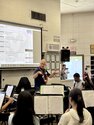 Henry Miller conducting music in classroom