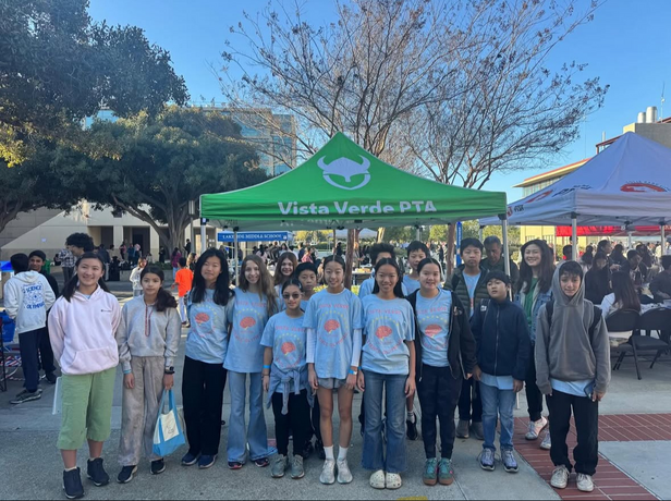 Turtle Rock Elementary Science Olympiad team photo, standing in front of school branded Easy-Up