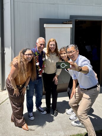Henry Miller and IUSD Board of Education smile for selfie