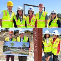 people wearing constructions uniforms posing