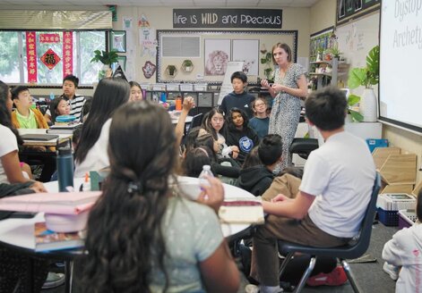 teacher in a classroom with students