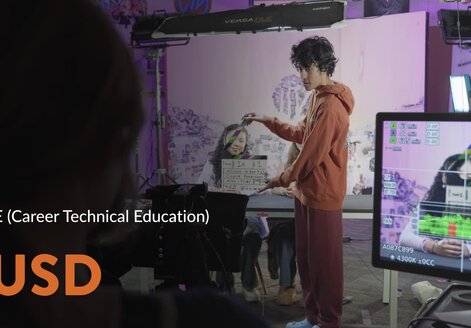 students in a film classroom preparing for a film shoot